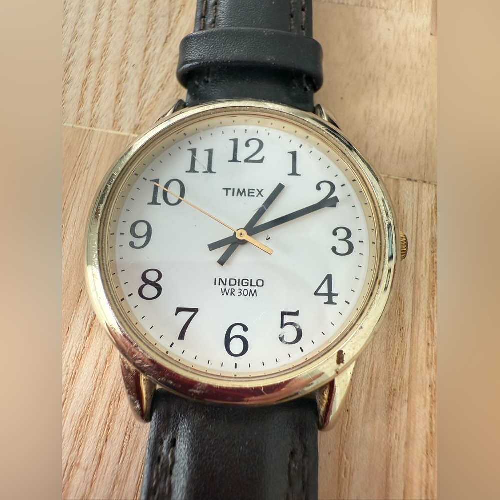Timex gold tone black leather watch NEW BATTERY